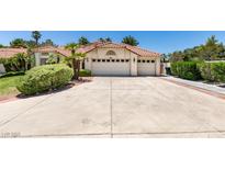 Charming single-story home showcasing a well-manicured front yard and a spacious three-car garage at 399 Discovery Ct, Henderson, NV 89014