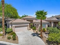 Charming single-story home with a tile roof, well-maintained landscaping, and a two-car garage in a sunny locale at 613 Via Linda Ct, Las Vegas, NV 89144