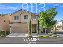 Charming two-story home with desert landscaping, a covered entrance, and a two car garage at 9113 Sea Mink Ave, Las Vegas, NV 89149