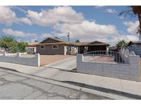Cozy single-story home featuring a large front yard and covered parking area at 922 Westminster Ave, Las Vegas, NV 89119