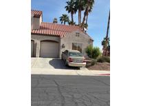 Charming single-Gathering home featuring a tile roof and a spacious two-car garage at 1701 Comstock Dr, Henderson, NV 89014