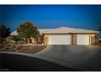 Charming single-story home with well-maintained landscaping and a three-car garage at 231 Bristle Cone, Pahrump, NV 89048