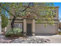 Charming two-story home featuring desert landscaping and an attached two-car garage at 3340 Epson St, Las Vegas, NV 89129
