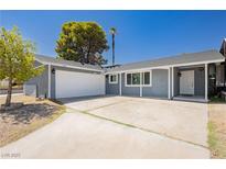 Charming single-story home with a well-maintained front yard and a two-car garage at 4492 Rita Dr, Las Vegas, NV 89121