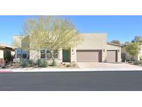 Contemporary single-story home with desert landscaping and a three-car garage at 2170 Monte Bianco Pl, Henderson, NV 89044