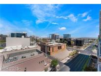 Expansive city views from a high rise feature blue skies, surrounding buildings and a well maintained street at 353 E Bonneville Ave # 711, Las Vegas, NV 89101