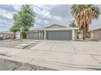 Charming single-story home with a spacious driveway and mature trees in a well-kept yard at 4269 Roanridge Ave, Las Vegas, NV 89120