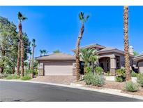 Charming single-story home with desert landscaping, a tile roof, and an attached two-car garage at 536 Pima Canyon Ct, Las Vegas, NV 89144