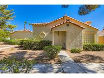 Charming single-story home with well-maintained front yard landscaping on a sunny day at 5425 Comchec Way # 103, Las Vegas, NV 89108