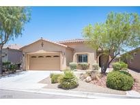 Inviting single-story home with a well-manicured front yard and attached two-car garage at 7252 Blowing Breeze Ave, Las Vegas, NV 89179