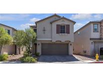 Charming two-story home featuring desert landscaping and a two-car garage at 7960 Calito St, Las Vegas, NV 89166