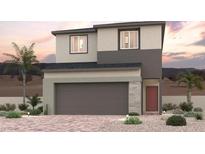 Two-story home showcasing a modern color scheme, low maintenance desert landscaping, and an attached two-car garage at 8514 W Agate Ave, Las Vegas, NV 89113
