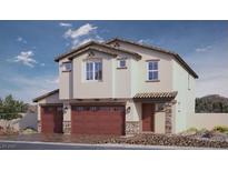 Inviting two-story home with desert landscaping, tile roof, and red garage doors at 1194 Dre Harbor Pl # Lot 87, North Las Vegas, NV 89084