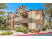 Condominium exterior featuring multiple balconies, red tile roofing, and professionally landscaped grounds at 2200 S Fort Apache Rd # 1101, Las Vegas, NV 89117