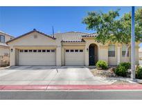 Charming single-story home with a three-car garage and desert landscaping at 5929 Caddy Ridge St, North Las Vegas, NV 89031
