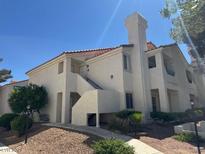 Two-story condominium building with a red tile roof and stucco exterior at 7905 Ryandale Cir # 201, Las Vegas, NV 89145