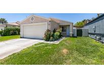 Cozy single-story home with well-maintained lawn and attached two-car garage at 1949 King Hill St, Las Vegas, NV 89106