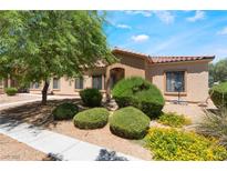 Charming single-story home with well-maintained landscaping, mature tree and desert flora in front yard at 2141 Hussium Hills St # 108, Las Vegas, NV 89108