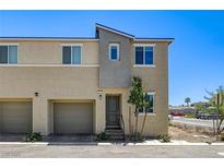 Charming two-story townhome featuring a private garage and modern architectural details at 5617 Craftsman Ave, Las Vegas, NV 89122