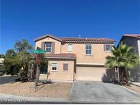 Charming two-story home with a well-maintained front yard and a spacious two-car garage at 8089 Windmill Villa St, Las Vegas, NV 89139