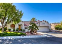 Charming single-story home with manicured lawn, desert landscaping, and a two-car garage at 9201 Yucca Blossom Dr, Las Vegas, NV 89134