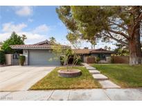 Charming single-story home featuring a spacious front yard and a two car garage at , Las Vegas, NV 89103