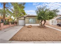 Charming single-story home featuring a well-maintained front yard and attached garage, enhancing curb appeal at 4630 Pratt Way, Las Vegas, NV 89147