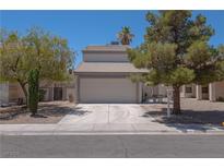 Charming two-story home with a two-car garage and well-maintained landscaping at 6601 W Pepperidge Way, Las Vegas, NV 89108
