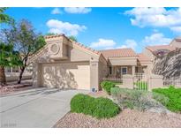Charming single-story home featuring a two-car garage and beautifully landscaped front yard at 8620 Prairie Hill Dr, Las Vegas, NV 89134