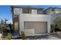 Modern two-story home with a two car garage and desert landscaping at 1560 Pacific Baza St, Las Vegas, NV 89138