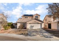 Charming two-story home featuring a well-maintained yard, two-car garage and solar panels at 4542 Silver Bit Ct, North Las Vegas, NV 89032