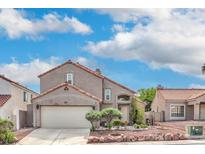 Charming two-story home with a well-maintained front yard and a two car garage at 56 Westheimer Rd, Henderson, NV 89074
