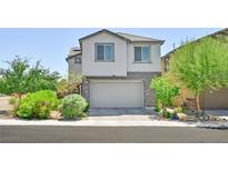 Charming two-story home with a stone facade and attached two-car garage in a well-maintained neighborhood at 949 Bayberry Ridge St, Henderson, NV 89052