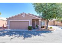 Charming single-story home with a two-car garage, covered entry, and well-maintained landscaping under a sunny sky at 5234 Panguitch Dr, Las Vegas, NV 89122