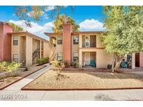 Attractive two-story exterior with private balconies and well-maintained landscaping at 5576 W Rochelle Ave # 9C, Las Vegas, NV 89103