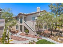 Inviting condo featuring a well-maintained exterior with stucco siding and desert landscaping at 5710 E Tropicana Ave # 1184, Las Vegas, NV 89122