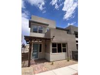 Modern two-story home featuring a light-blue front door and stylish architectural details at 1527 Melodic Lark Dr, Las Vegas, NV 89138